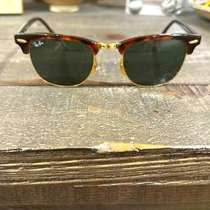 Black and brown RayBan sunglasses.